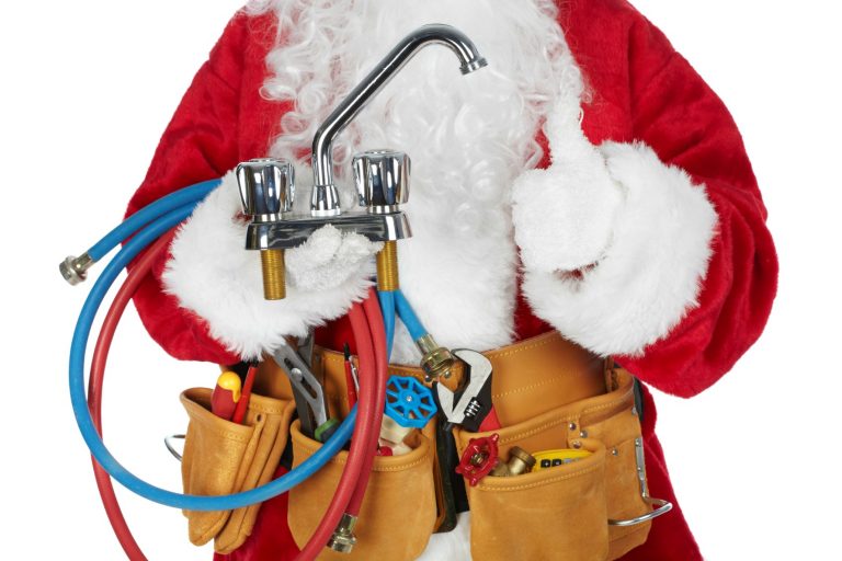 Santa Worker with a tool belt over white background.